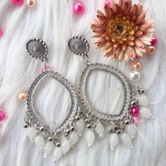 silver jhumka bezel with white beads in eyes shape